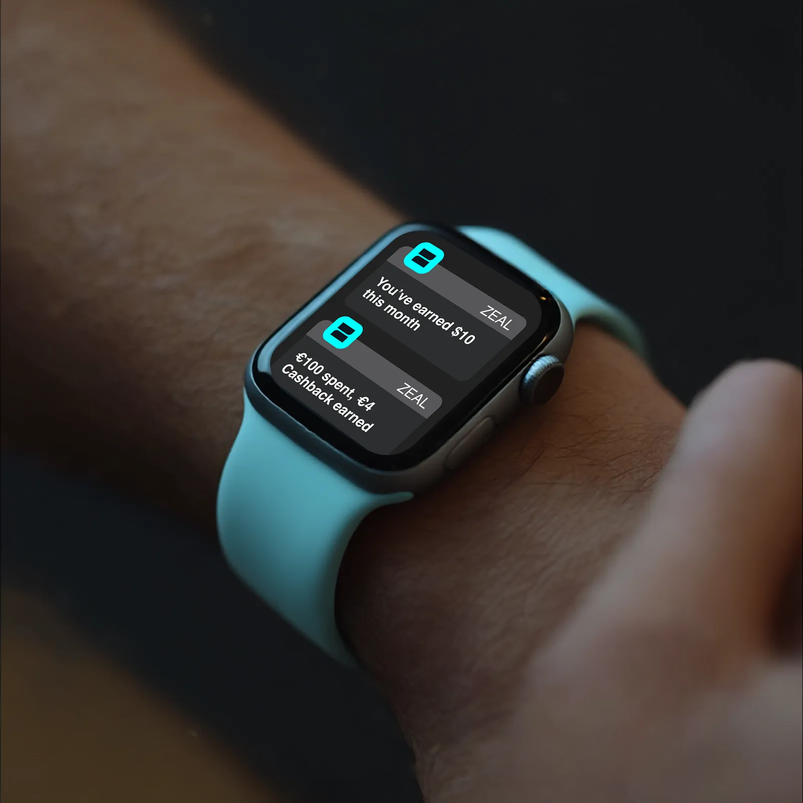 Close-up of a smartwatch displaying Zeal app notifications for earning $10 and €4 in cashback rewards this week.